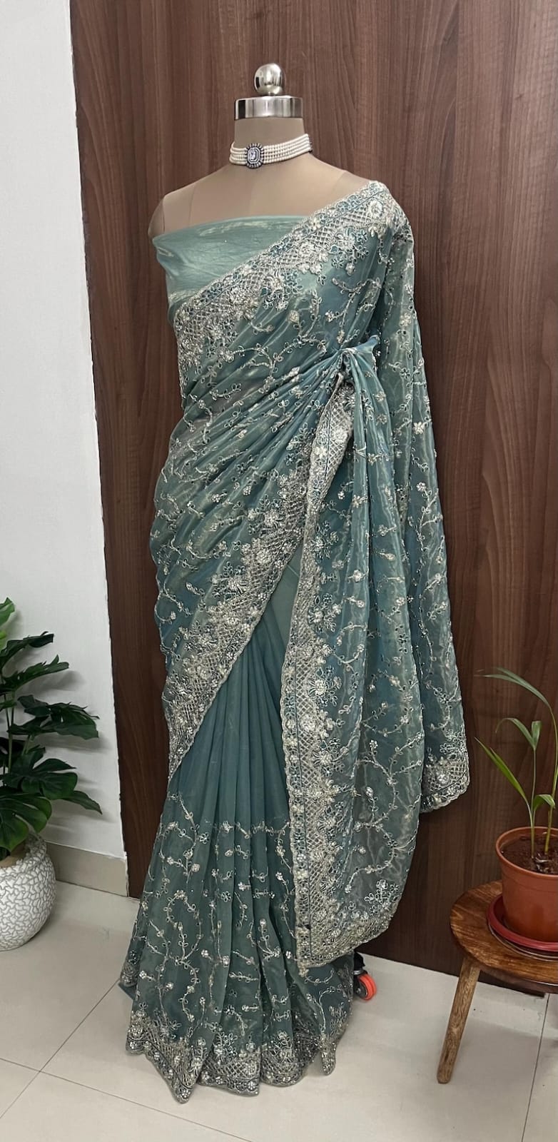 Beautiful net saree with colourful thread work and running blouse piece