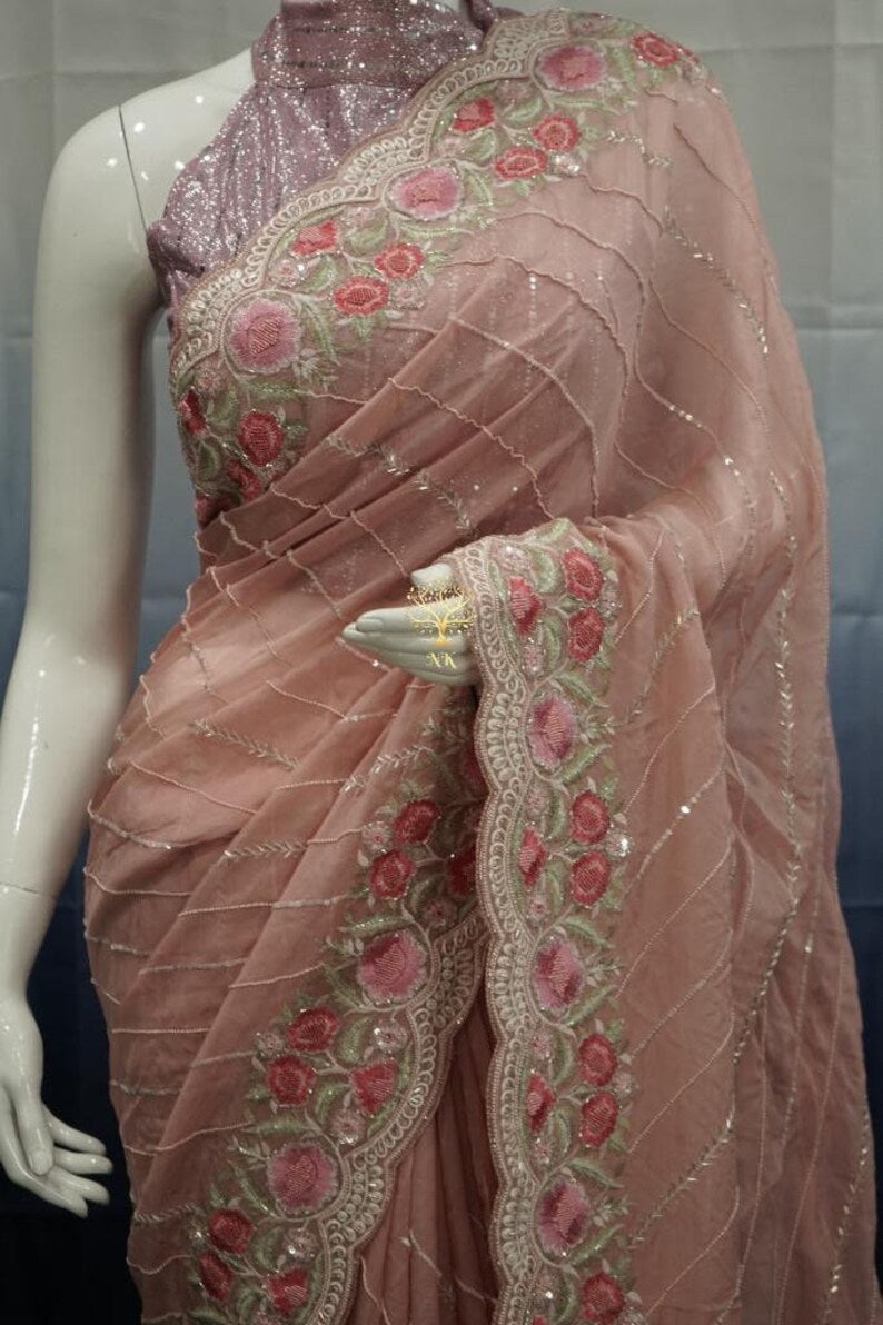 Beautiful pure organza saree with cutdana and sequence work all over.