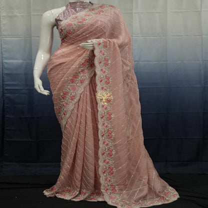 Beautiful pure organza saree with cutdana and sequence work all over.