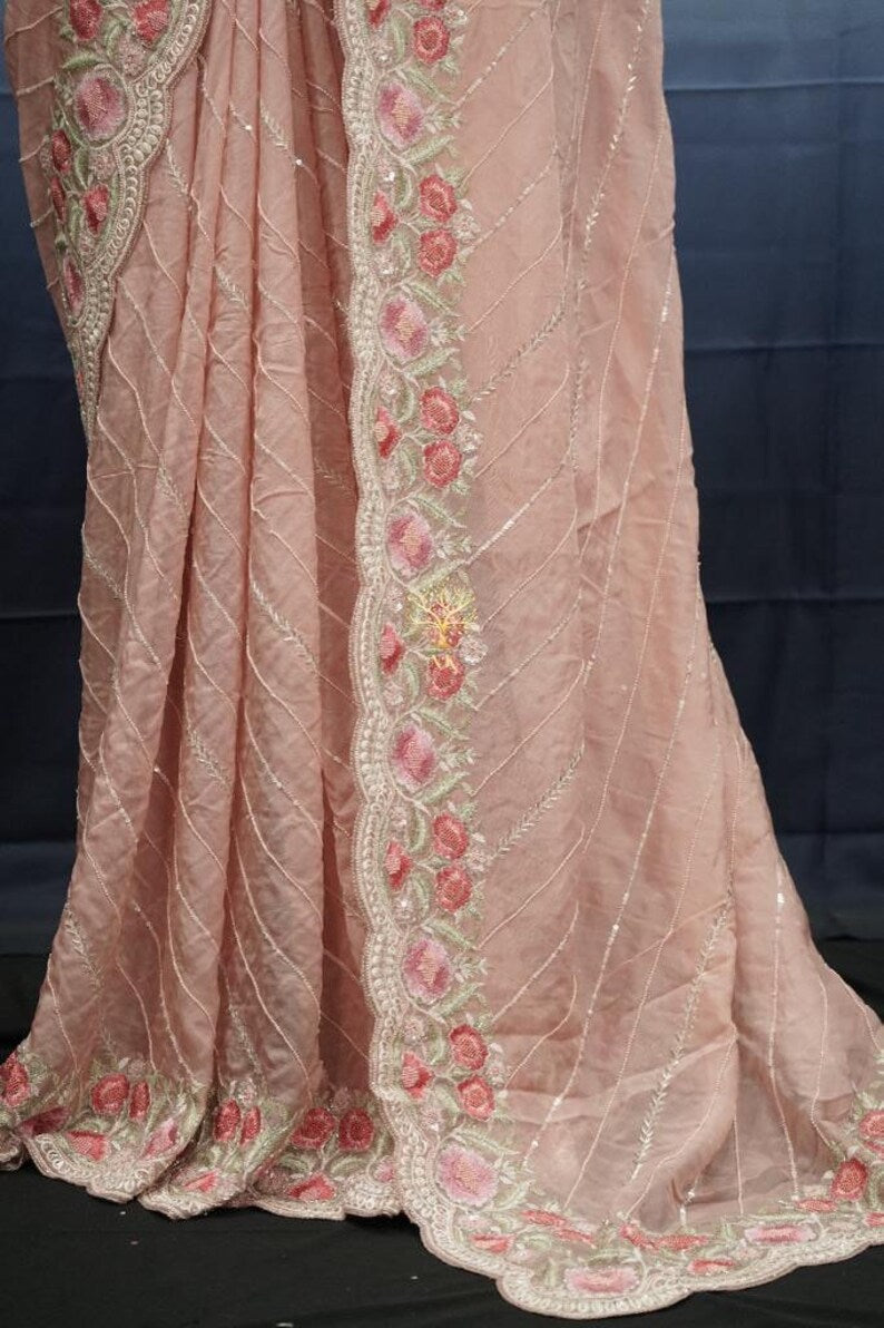 Beautiful pure organza saree with cutdana and sequence work all over.